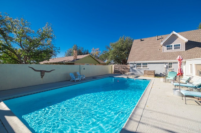 view of swimming pool with a patio area