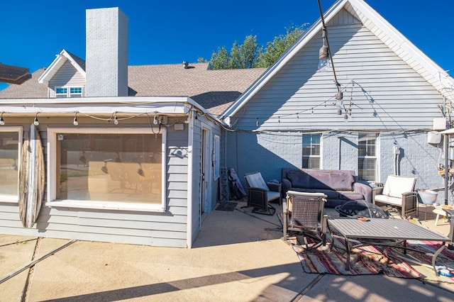 rear view of property with a patio