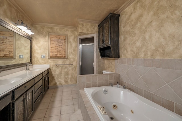 bathroom featuring tile patterned flooring, vanity, crown molding, and shower with separate bathtub