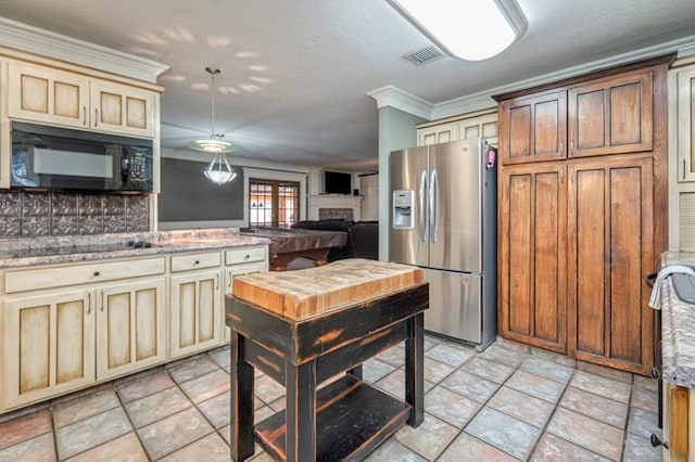 kitchen featuring a textured ceiling, black appliances, ornamental molding, and tasteful backsplash