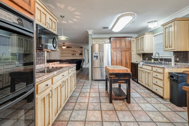 kitchen featuring pendant lighting, black appliances, sink, backsplash, and ornamental molding