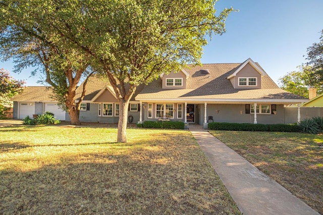 view of front of home featuring a garage and a front yard