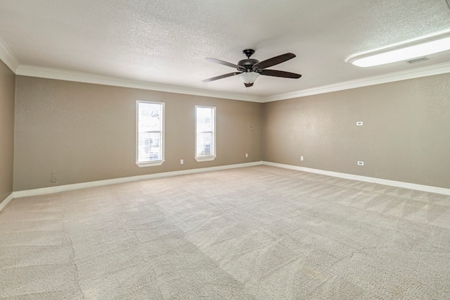 unfurnished room featuring ceiling fan, ornamental molding, light carpet, and a textured ceiling