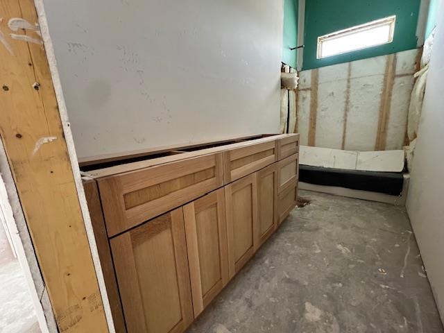 bathroom featuring concrete flooring