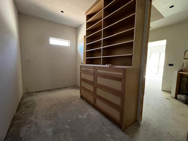 interior space with unfinished concrete floors