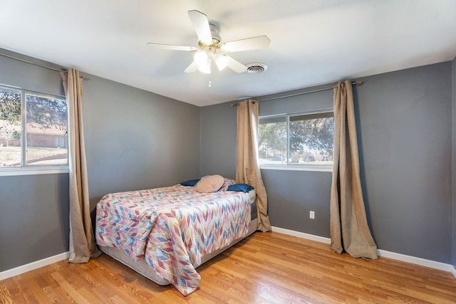 bedroom featuring ceiling fan and light hardwood / wood-style floors