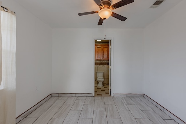 unfurnished room featuring ceiling fan