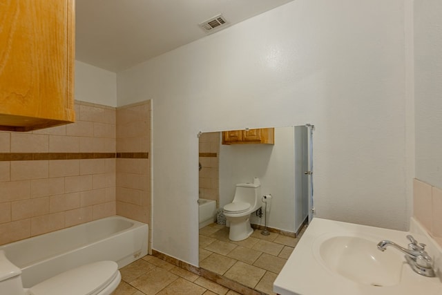 bathroom featuring tile patterned flooring, sink, and toilet