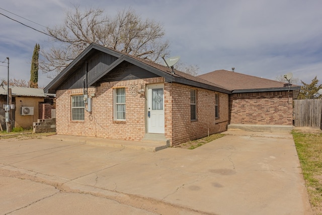 view of side of home with a patio