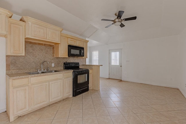 kitchen with light tile patterned flooring, sink, decorative backsplash, black appliances, and a raised ceiling