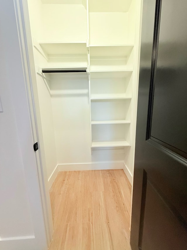 walk in closet featuring light wood-type flooring