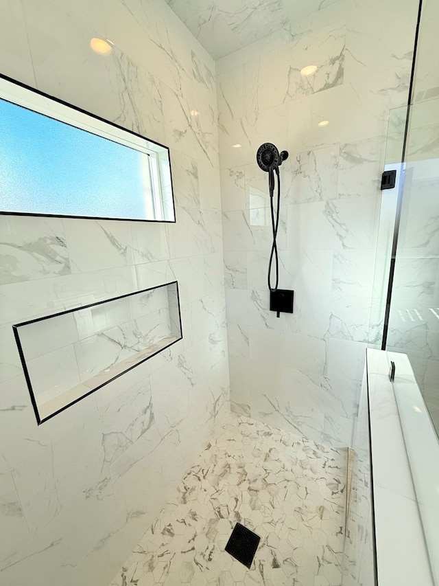 bathroom featuring tiled shower