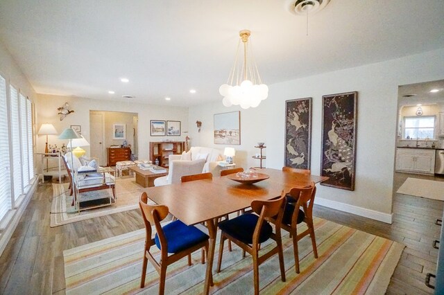 5 Bristol Ct, Midland, TX 79705 - dining room featuring baseboards, wood finished floors, recessed lighting, and a chandelier
