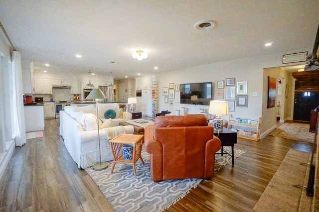 5 Bristol Ct, Midland, TX 79705 - living room with wood finished floors and recessed lighting