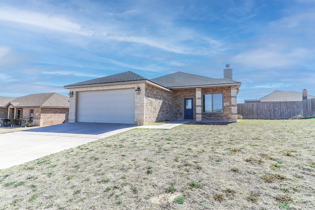 view of front facade with a garage and a front lawn