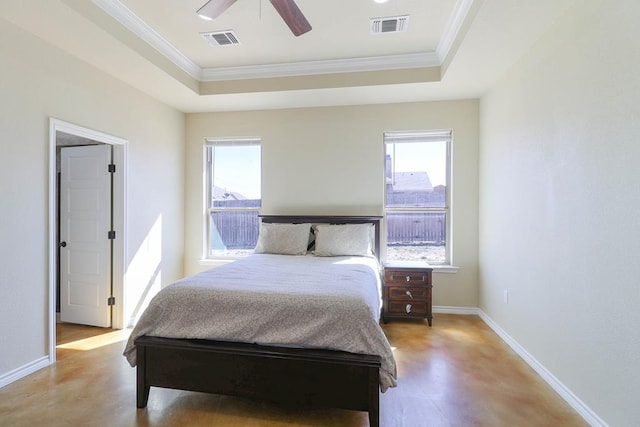 bedroom featuring a raised ceiling, ceiling fan, and crown molding