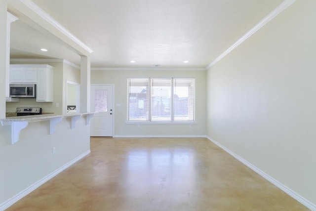 unfurnished living room with ornamental molding