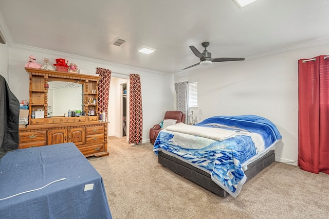 carpeted bedroom featuring crown molding and ceiling fan