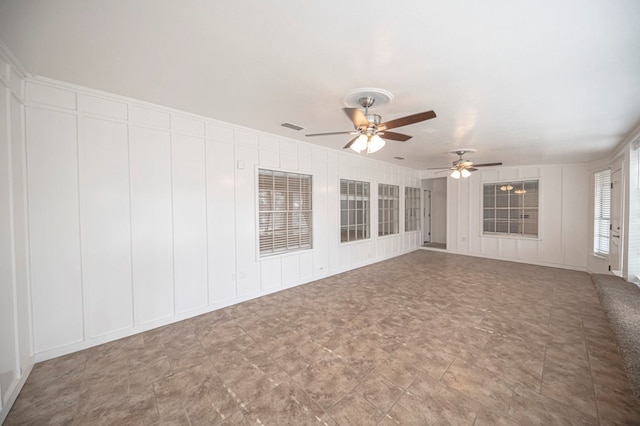 unfurnished living room with ceiling fan