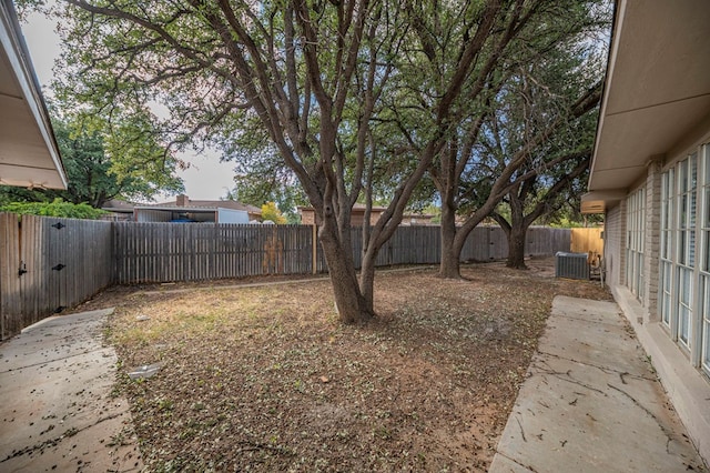 view of yard with central AC