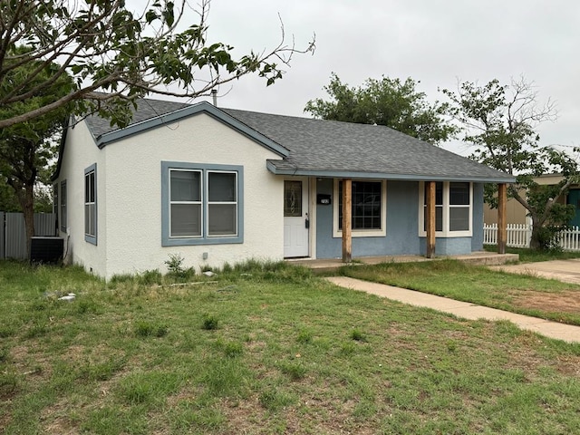 ranch-style house featuring a front yard and a porch