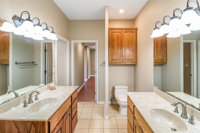 bathroom with vanity, tile patterned floors, and toilet