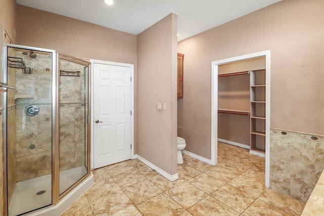 bathroom with walk in shower and toilet