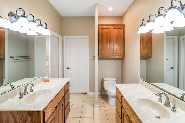 bathroom with vanity, toilet, and tile patterned flooring