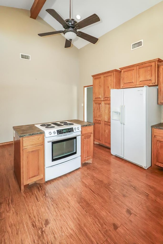 kitchen with ceiling fan, vaulted ceiling with beams, white appliances, and light wood-type flooring