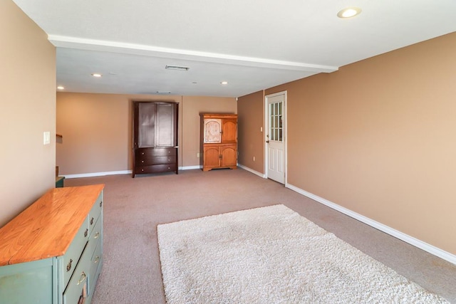 unfurnished living room featuring dark colored carpet