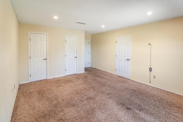 unfurnished bedroom with carpet