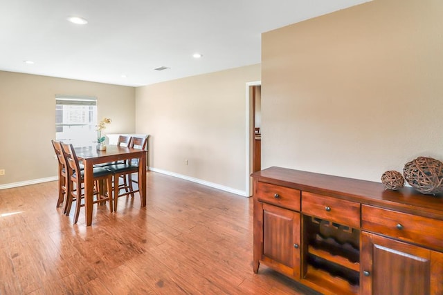 dining area featuring light wood-type flooring