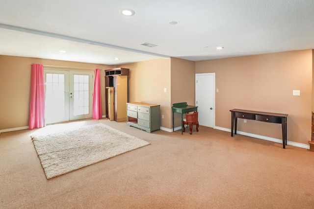 interior space featuring light colored carpet and french doors