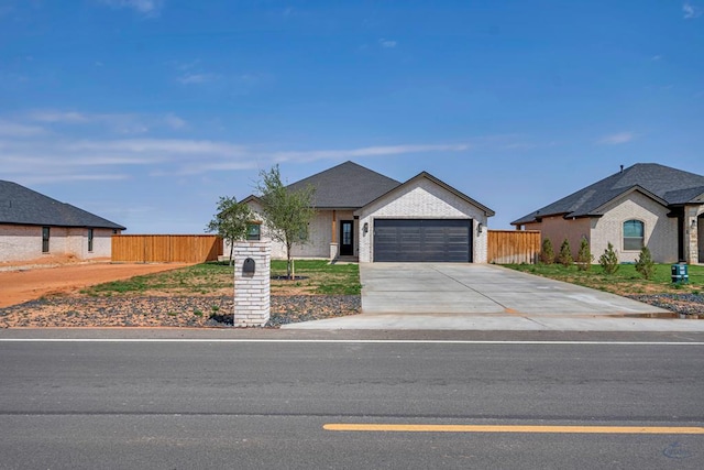 13227 E County Rd 110, Midland, TX 79706 - ranch-style home with concrete driveway, fence, and a garage
