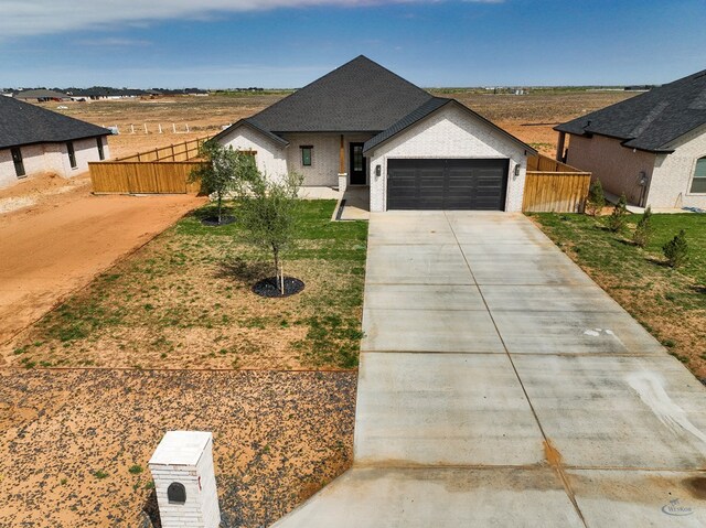 13227 E County Rd 110, Midland, TX 79706 - full bathroom featuring baseboards, double vanity, a sink, and wood finished floors