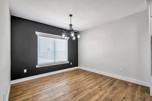 13227 E County Rd 110, Midland, TX 79706 - unfurnished living room with a ceiling fan, visible vents, light wood-style floors, a fireplace, and beam ceiling