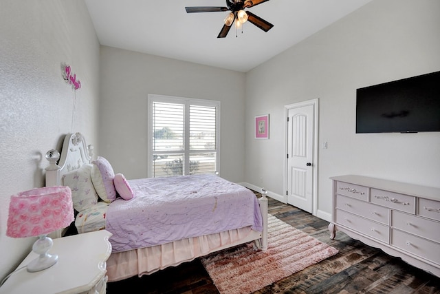 bedroom featuring baseboards, dark wood-type flooring, and a ceiling fan