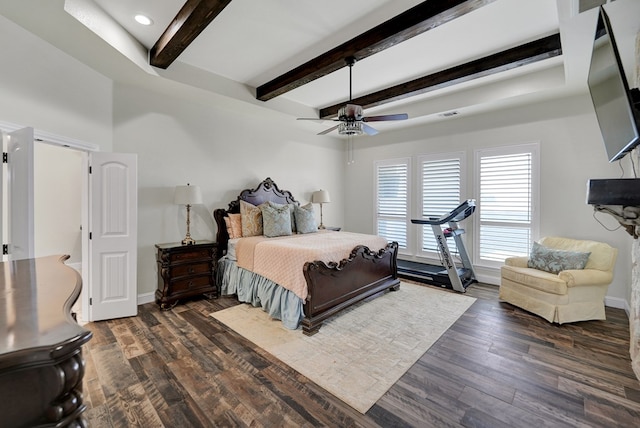 bedroom featuring beamed ceiling, baseboards, dark wood-style floors, and a ceiling fan