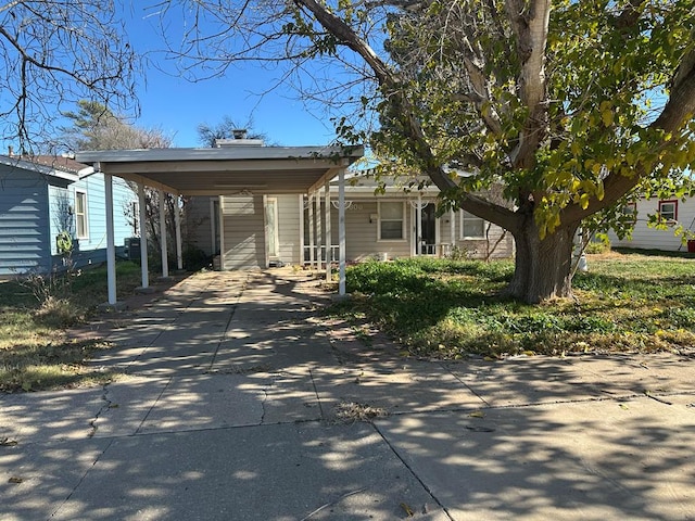 view of front of home featuring a carport