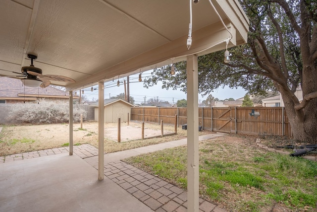 view of patio featuring a shed and ceiling fan