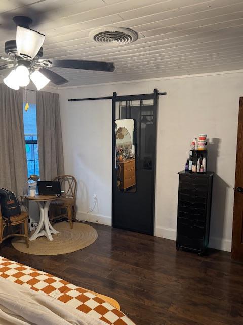 sitting room with a barn door, ceiling fan, wood ceiling, and dark hardwood / wood-style floors