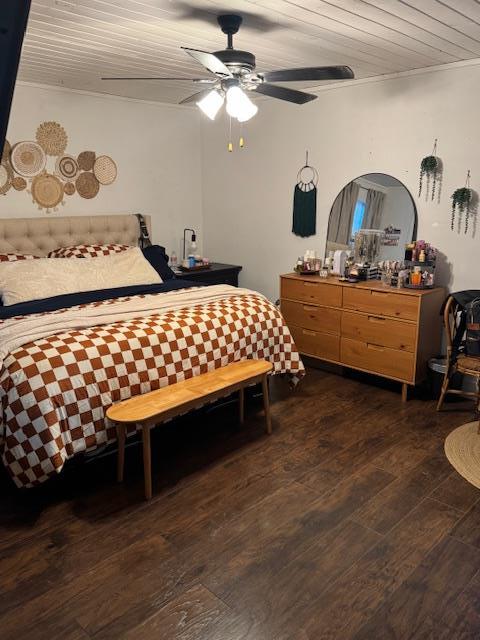 bedroom with wooden ceiling, ceiling fan, and dark wood-type flooring