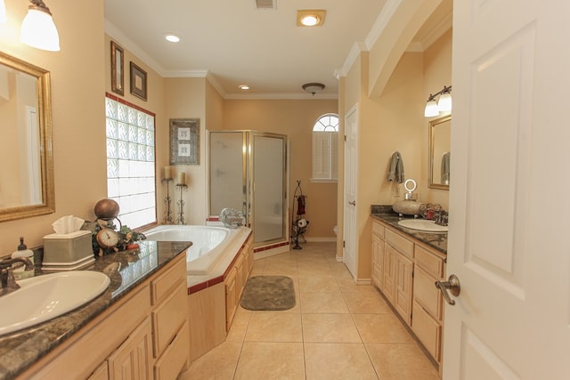 bathroom with tile patterned floors, vanity, shower with separate bathtub, and ornamental molding