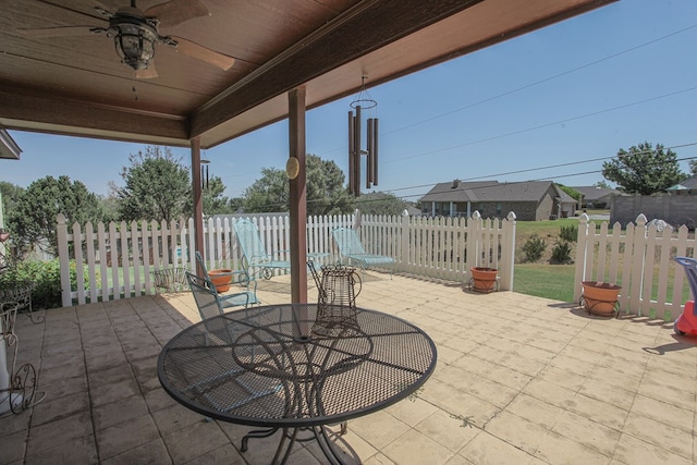 view of patio featuring ceiling fan