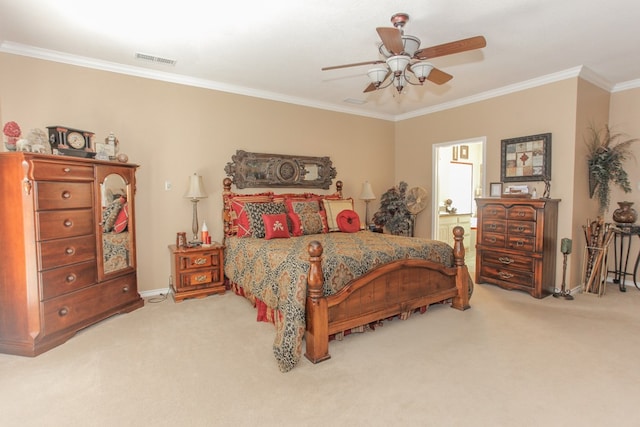 carpeted bedroom with ceiling fan and crown molding