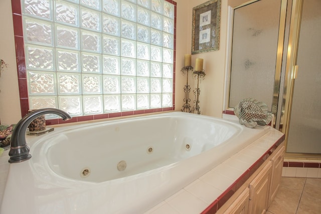 bathroom featuring tile patterned floors and plus walk in shower