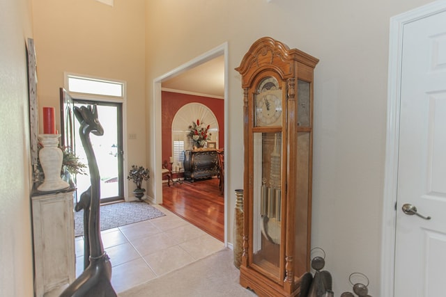 entryway featuring light hardwood / wood-style flooring and crown molding