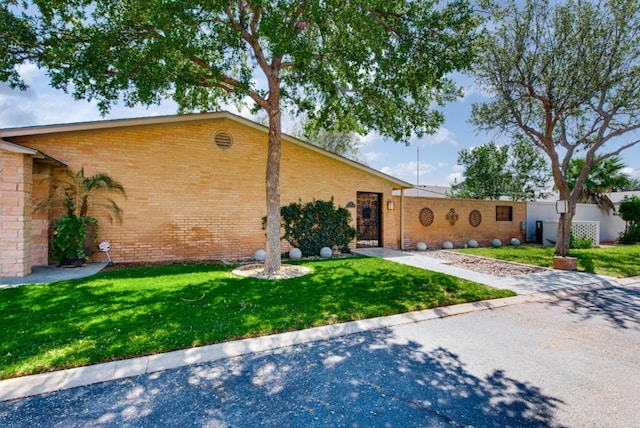 view of front of home with a front lawn