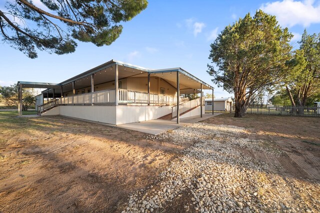 view of property exterior featuring a patio area