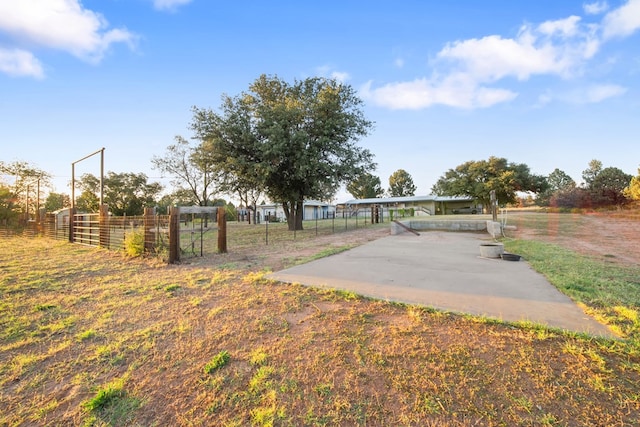 view of yard with a rural view